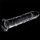 The Flawless Clear Dildo 7 from the LOVETOY Shameless Clear Series showcases a flared design and intricate etchings. Set on a dark, reflective surface against a black backdrop, this skin-safe transparent toy beautifully captures highlights and shadows.