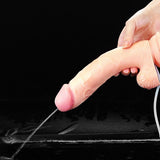 A hand holds the Cumming Softee Soft Ejaculation Cock 9 with Balls. The realistic dildo, featuring prominent veins and a pink tip, is connected to a tube. Water squirts from the tip against a black background for contrast.