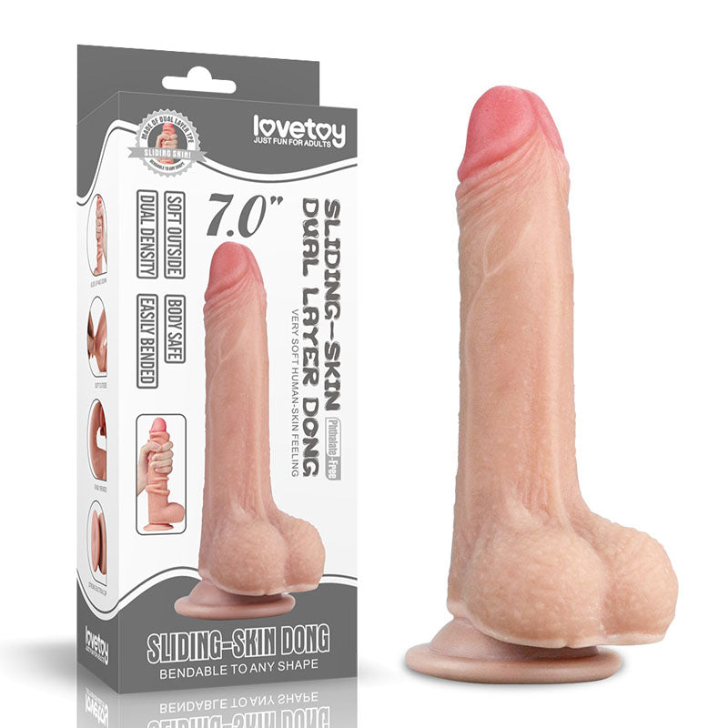 The packaging of the Lovetoy Sliding Skin Dual Layer Dong 17.8 cm highlights its lifelike feel with dual density technology, featuring a soft outer skin, bendable shape, flesh-colored veiny texture, and a suction base. The lovetoy brand is prominently displayed on the box.