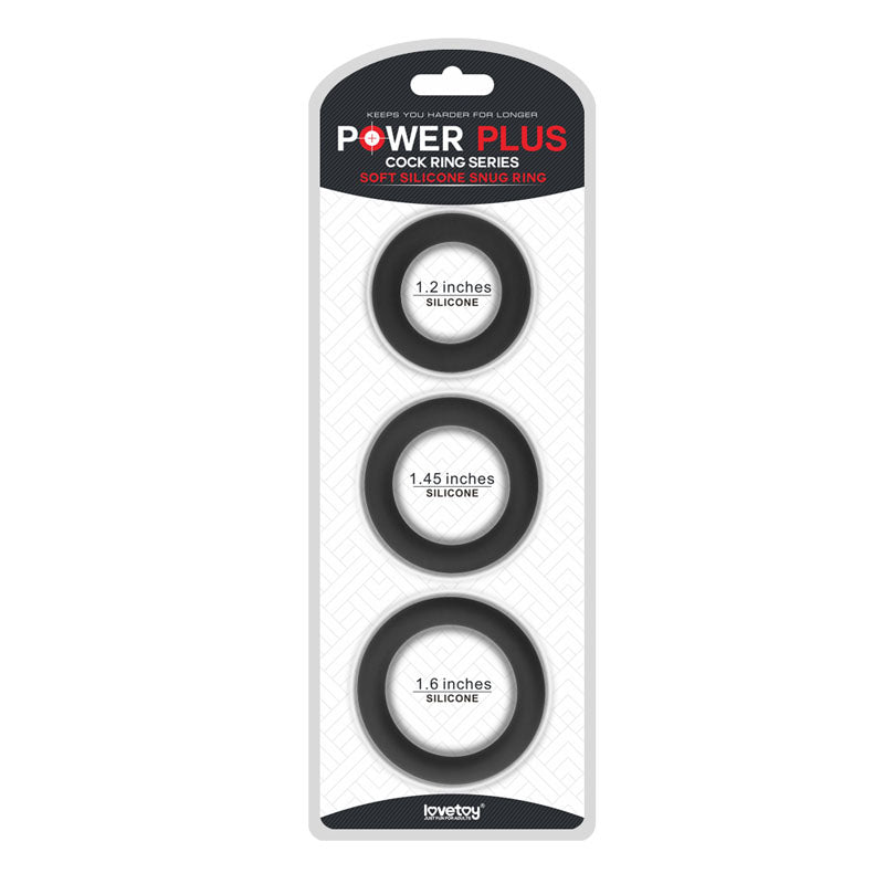 The Power Plus Soft Silicone Snug Ring set includes three black cock rings, designed to enhance erections with diameters of 1.2, 1.45, and 1.6. Displayed vertically in clear compartments on a white background, these durable rings offer exceptional performance.