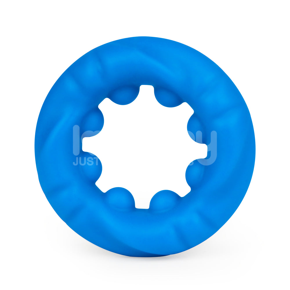 The Pinnacle Pro Ridge Bump Stretcher - Blue Cock Ring is a circular toy crafted from premium silicone, featuring a central star-shaped cutout. Its smooth, wavy texture resembles a gear or cog for enhanced stimulation against a plain white background.