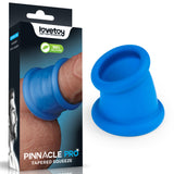 The blue silicone Pinnacle Pro Tapered Squeeze sits beside its packaging, which displays the Lovetoy brand and a photo of it in use. The box highlights 100% Silicone. Perfect for pairing with your favorite silicone penis ring.