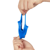 Two hands stretch a blue, flexible Pinnacle Pro Trio Grip Enhancer - Blue Cock & Balls Ring. One hand holds the bottom while the other pulls the top loop upward. The soft, stretchy silicone accessory features a vibrant color and an abstract triple-hole design.