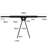 Diagram of the black T-shaped Ingen Vibrating Easy Strap-On Stand with total width 138 cm, central height 50 cm. Horizontal bar ends are 11.5 cm, narrowing like an adjustable harness. One leg is 9 cm wide and 1.5 cm thick; another is tilted right, measuring 3.5 cm wide.