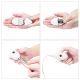 Four images illustrate assembling the Ingen Vibrating Easy Strap-On Set. Top left: removing the back cover. Top right: inserting a battery. Bottom left: securing with an adjustable harness. Bottom right: plugging in a USB cable. The device is white, handheld, and oval-shaped.