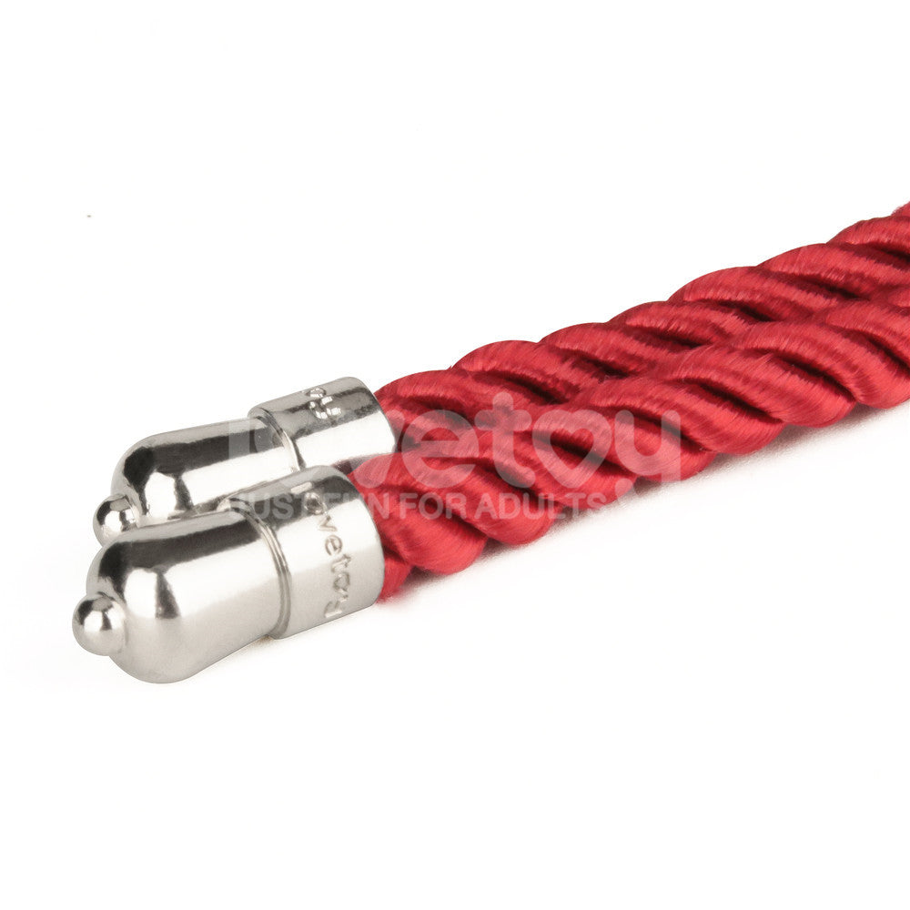 The Rebellion Reign Silky Bondage Rope is a vibrant red braided polyester rope with metallic silver cylindrical caps, offering a smooth appearance and reflective sheen that contrasts with its vivid hue.