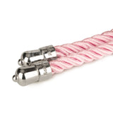 Close-up of the Rebellion Reign Silky Bondage Rope in pink, featuring shiny silver, smooth rounded metal caps. Its silky finish enhances the thick, neatly coiled texture, offering an elegant and refined look perfect for intricate bondage designs.