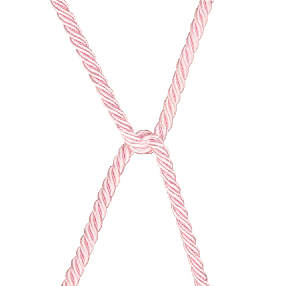 The Rebellion Reign Silky Bondage Rope in pink is arranged in an X shape on a white background, with its silky finish highlighting the woven texture and intricate design as it interlocks at the center.