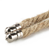 Close-up of two beige Rebellion Reign Hemp Bondage Ropes with shiny silver conical caps on a white background. The rustic texture ropes are parallel, each ending in smooth, reflective metallic caps.