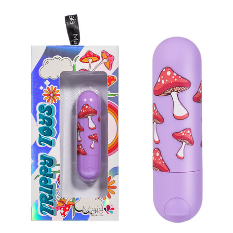 Discover the Maia JESSI Trippy, a 7.6 cm lavender bullet vibrator designed by Jessi Trippy, adorned with red mushrooms on a purple background. The silicone-coated toy comes in a Trippy Toys box with psychedelic patterns and a transparent section for an electrifying experience. USB rechargeable.