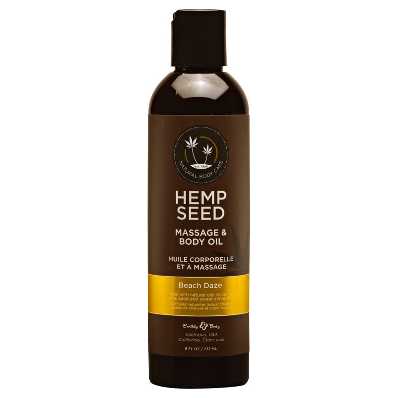 The Hemp Seed Massage & Body Oil - Beach Daze (Coconut & Pineapple) Scented comes in a 237 ml dark bottle with a black cap, featuring a circular logo with hemp leaves. Labeled Natural Body Care, it originates from California, USA.