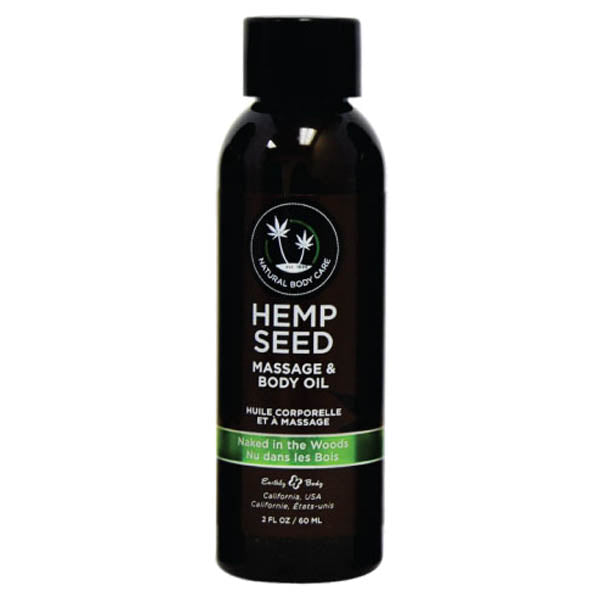 A black 59 ml Hemp Seed Massage & Body Oil bottle labeled Natural Body Care with vegan ingredients. It says Naked in the Woods with a French translation, has a green stripe, and is made by Earthly Body in California, USA.