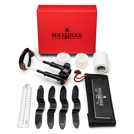 The MaleEdge Pro Kit - Penis Enlarger Kit in Red Case includes a red and black adjustable device, four black comfort pads, two white foam rings, gauze, a measuring ruler, and a storage pouch, all housed in the iconic red Male Edge box.