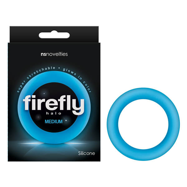 The Firefly Halo - Glow In Dark Blue Medium 55 mm Cock Ring by NS Novelties showcases its super stretchable, glow-in-the-dark design and vibrant blue hue beside its packaging, promising extended performance.