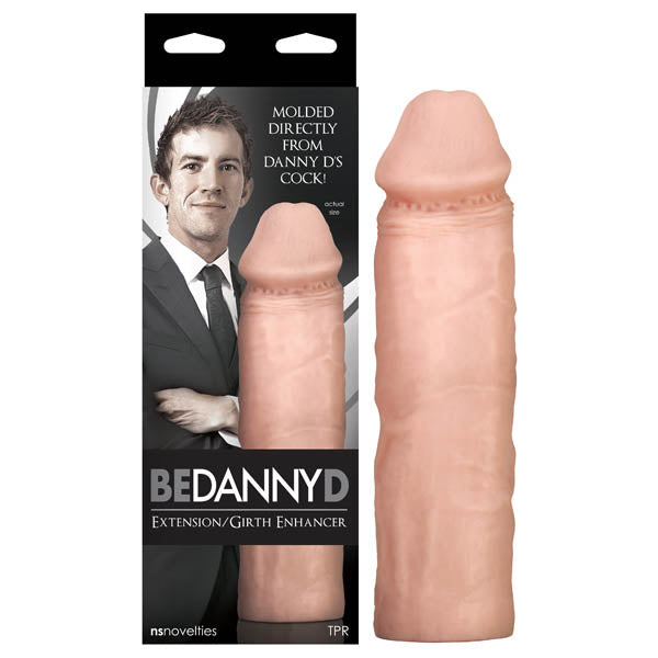 The Be Danny D! Extension/Girth Enhancer packaging features a suited man. Made from body-safe TPR in light beige, this extension imitates human anatomy, molded uniquely from Danny Ds body for an authentic feel.