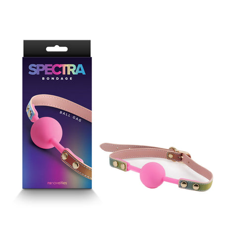 The image showcases the Spectra Bondage Ballgag - Rainbow, ideal for BDSM play. This pink gag has an adjustable PU leather strap with metal studs and a green, tan, and pink gradient. The packaging emphasizes the product name against a colorful gradient design.