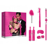 The Ouch! Beginners Bondage Kit - Pink - 5 Piece Set includes a feather tickler, flogger, ball gag, cuffs for wrists and ankles, collar with leash, and blindfold. The packaging features a couple exploring their intimacy with these items and prominently displays the Ouch! brand.