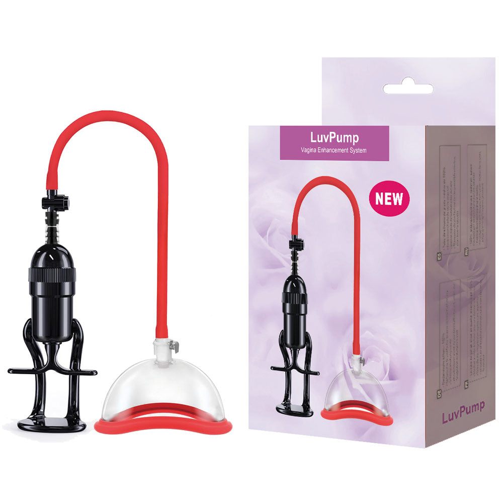 The LuvPump Vagina Enhancement System - Clear/Red Vagina Pump includes a medical-grade polycarbonate cup, a red tube, and a black suction pump. The box features the device with LuvPump and NEW against a floral background.