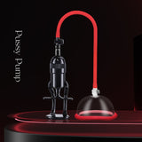 The LuvPump Vagina Enhancement System features a clear, medical-grade polycarbonate suction cup connected by a red hose to a black hand pump with an ergonomic grip handle, all set against a dark background and highlighted in glossy lighting for optimal enhancement.