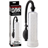 The image shows a Pump Worx Silicone Power Pump - Clear Penis Pump for erection enhancement. It includes a black rubber bulb for manual suction and features a flexible hose. Displayed next to its packaging, the product branding details are visible.