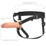 Text on image: FX Elite 6 Silicone Hollow Strap-On - Flesh: Width 1.6 in (4.1 cm), insertable length 6 in (15.2 cm). Waist size range: 24-53 in (61-135 cm). Image shows an adjustable strap-on harness with a dual-density hollow design for realism and comfort, featuring black straps.