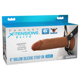 The FX Elite 6 Silicone Hollow Strap-On - Tan features a dual-density design for realism. Packaged in blue and white, it highlights its soft head, adjustable straps, and premium Elite Silicone quality with clear branding and product details.