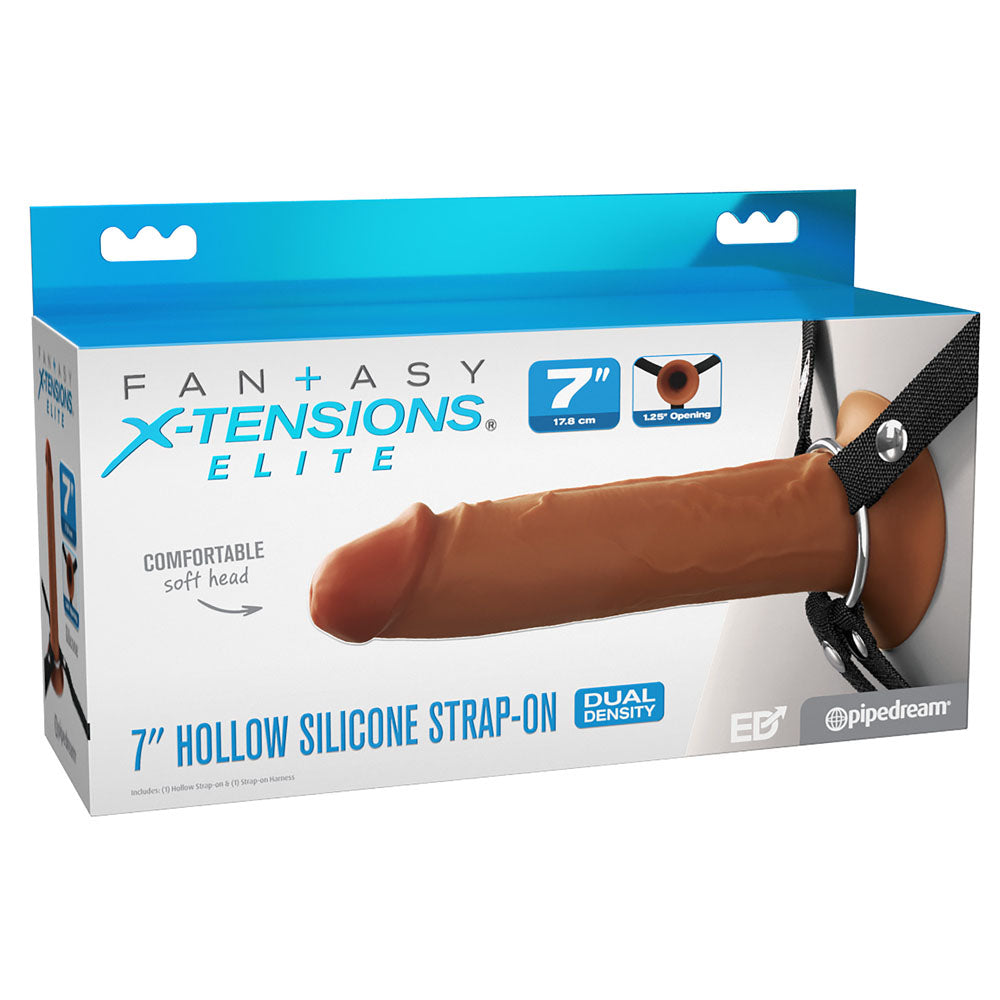 Box of FX Elite 7 Silicone Hollow Strap-On by Pipedream in tan. Front image highlights the comfortable soft head and Dual-Density Design with a 1.5 opening. Blue and white packaging prominently showcases key details of this Elite Silicone™ product.