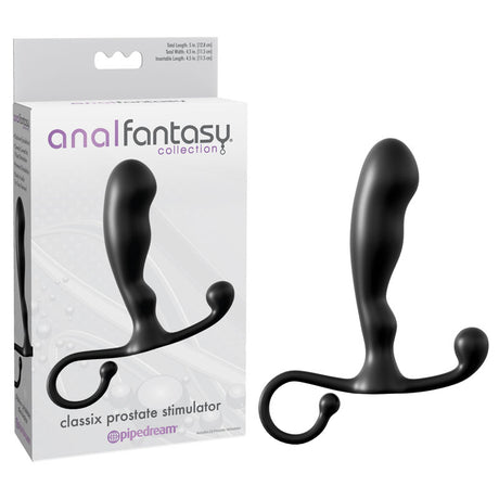 The image features the black Anal Fantasy Collection Classix Prostate Stimulator, a 10.1 cm curved massager with a grip handle, perfect for P-Spot stimulation. It sits beside its packaging, highlighting its sleek design and the Pipedream logo—ideal for beginners exploring anal play.