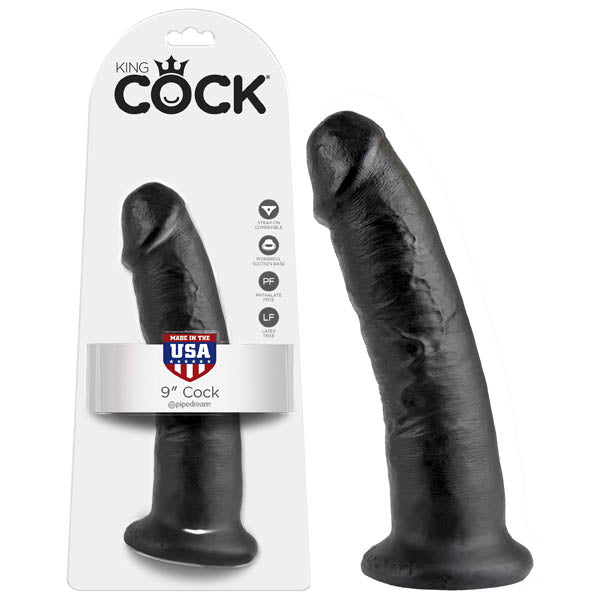 The King Cock 9 Dong, made of body-safe materials, stands with its packaging. It features a textured surface and a strong suction cup base, highlighting its Made in the USA quality.