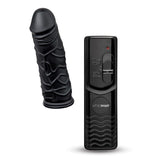 The Whipsmart Inflatable Bangin Bolster is a black inflatable cushion featuring a 6 vibrating dong with detailed veins and tip. It includes a remote control with adjustable settings, a sliding button, and LED indicator, all in a sleek, modern whipSMART design.