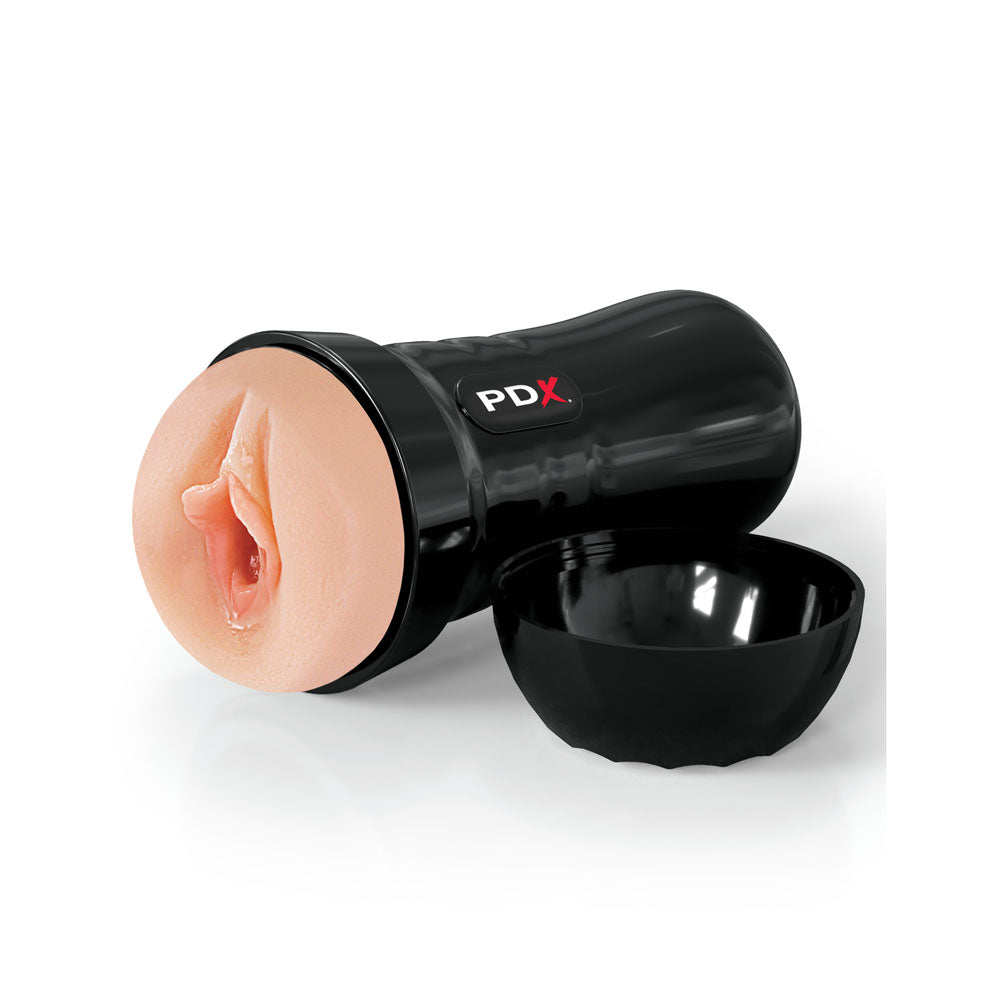 The PDX Extreme Wet Pussies - Super Juicy Snatch - Flesh Vagina Stroker is a black-cased adult novelty item with an EZ Grip design and textured exterior. It features a self-lubricating stroker, a removable cap revealing a beige entrance, and realistic details with the PDX logo on its glossy surface.