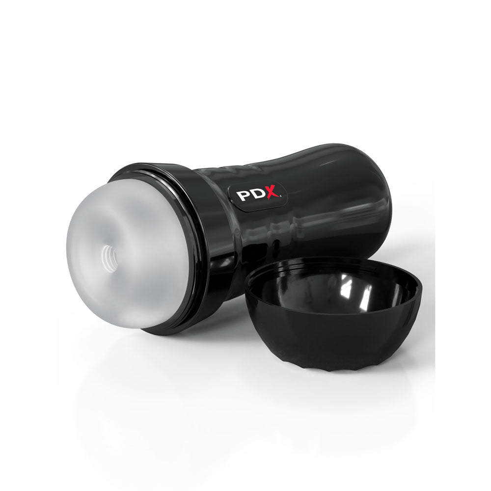 A translucent PDX Extreme Wet Strokers Super Slide & Glide - Clear Stroker with EZ Grip design features a disassembled black lid. Its elegantly displayed on a reflective white surface.