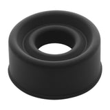 The LuvPump ComFit Silicone Sleeve in black is a durable, flexible cylindrical piece ideal for sealing or cushioning tasks. Its wide circular shape, smooth rounded edges, and matte finish with subtle shadows enhance its aesthetic similar to an airtight vacuum seal.