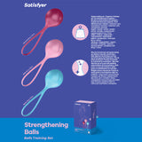 The Satisfyer Strengthening Balls set includes three maroon, pink, and teal Kegel balls with looped handles for pelvic floor training against a purple background. The packaging emphasizes benefits for pelvic health and orgasm enhancement.