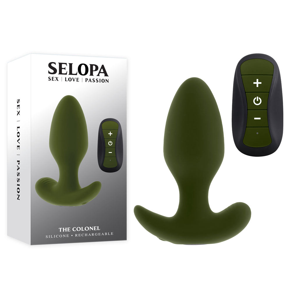 A green Selopa THE COLONEL 10.1 cm vibrating silicone plug with a curved base is next to a black remote featuring plus and minus buttons. The SELOPA box, labeled SEX | LOVE | PASSION, displays the same image alongside THE COLONEL and SILICONE - RECHARGEABLE.