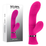 The Selopa NEXT WAVE, a vibrant pink 16.4 cm USB rechargeable dual vibrator, is shown against a white backdrop. It has a smooth, curved design with ribbed texture and silver accent ring near the base. Packaging reads SELOPA SEX | LOVE | PASSION.