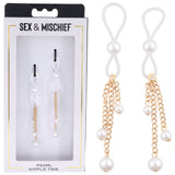 A close-up displays a box labeled Sex & Mischief containing Pearl Nipple Ties with adjustable ties, featuring white loops, dangling gold chains, and faux pearls. A black and white tie pair is shown outside the box on the right for detail. Product: Sex & Mischief Pearl Nipple Ties - Set of 2.