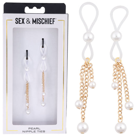 A close-up displays a box labeled Sex & Mischief containing Pearl Nipple Ties with adjustable ties, featuring white loops, dangling gold chains, and faux pearls. A black and white tie pair is shown outside the box on the right for detail. Product: Sex & Mischief Pearl Nipple Ties - Set of 2.