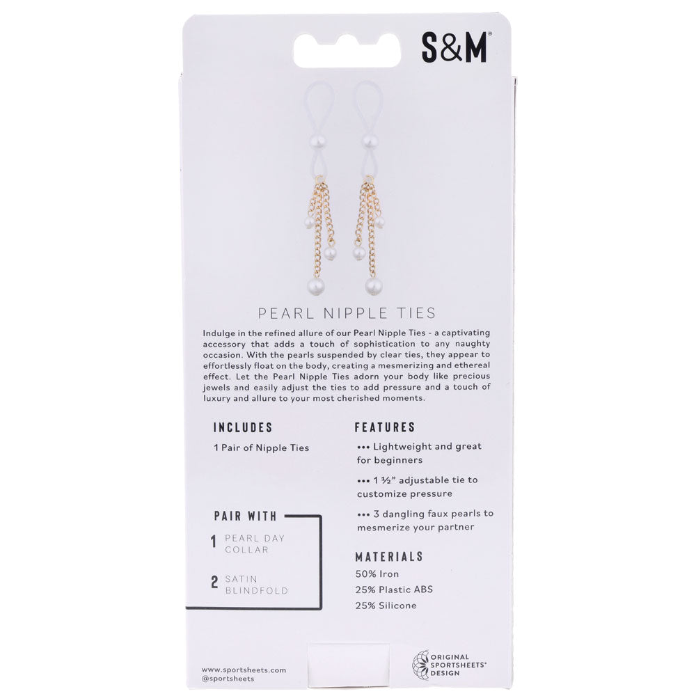 The back of the Sex & Mischief Pearl Nipple Ties package features faux pearl-adorned ties labeled S&M. It highlights their lightweight design and adjustable fit. A graphic showcases the elegant pearl and chain details, making them a chic addition to your collection.