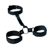 The Sex & Mischief Shadow Neck and Wrist Restraint includes adjustable nylon ankle and wrist cuffs with Velcro closures, connected by a metal ring forming a triangle, ideal for BDSM beginners seeking secure restraint.