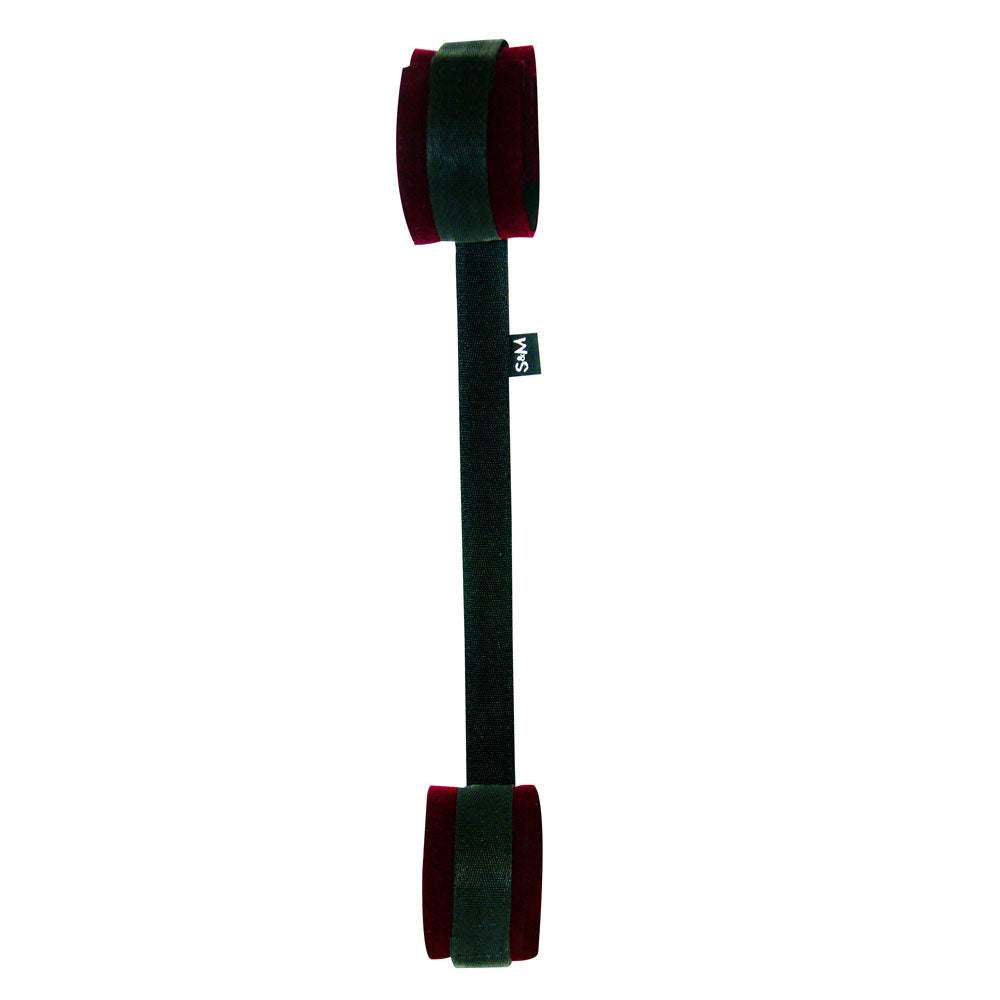 A minimalist BDSM-inspired black velvet slip-on violin/viola mute with red pads for dampening, labeled SVS, evokes the sleek design of the Sex & Mischief Enchanted Spreader Bar - Black/Red Restraints, ensuring discreet performance without sacrificing quality.