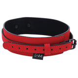 The Sex & Mischief Amor Collar and Leash - Red Restraint is made of red and black vegan leather, featuring intricate black stitching, a sleek black buckle with adjustable strap, and a discreet S&M tag. The bold black interior complements the design, ideal for pairing with a chain leash.