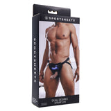 The SPORTSHEETS Dual Desires Strap On displays a person wearing the stylish black harness with a purple ring, emphasizing its adjustable straps for comfort. Ideal for those seeking versatility and comfort in a dual penetration system. (Probe not included.).