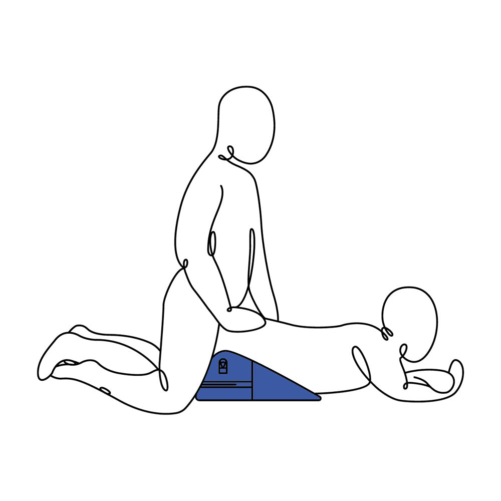 Two stylized figures, one kneeling behind the other, are illustrated in an intimate position. The front figure is supported by a Pivot Positioner - Black Foam Position Cushion shaped like a blue triangle. Both minimalistic figures are gender-neutral against a white backdrop.