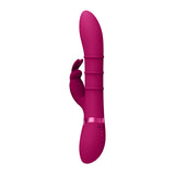 The VIVE Sora USB Rechargeable Rabbit Vibrator in dark pink features a sleek silicone shaft, ribbed design, and rabbit ear side extension for dual stimulation. Its waterproof with a metallic pink accent at the base and two control buttons, blending modern design with ergonomic comfort.