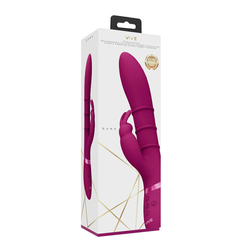 The packaging of the VIVE Sora - Pink Rabbit Vibrator flaunts a pink ergonomic device from various angles. Gold geometric lines decorate the box, and a gold seal highlights its features. With a silicone shaft and waterproof capabilities, this 24.2 cm USB rechargeable product stands out effortlessly.