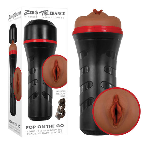 The Zero Tolerance POP ON THE GO Dark - Brown Vagina Masturbator, featuring black and red detailing with a fleshy, ribbed opening, sits beside its packaging. The box displays the product alongside branding text Zero Tolerance and Pop on the Go, highlighting the realistic strokers inviting opening.