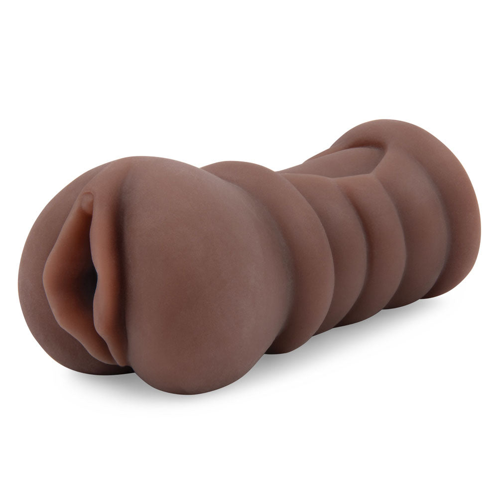 The Zolo Stroke Off Diva Pussy Stroker is a brown vagina stroker featuring a lifelike skin tone, spiral pattern, and matte surface resembling an abstract tunnel. It is styled against a plain white background for artistic presentation.