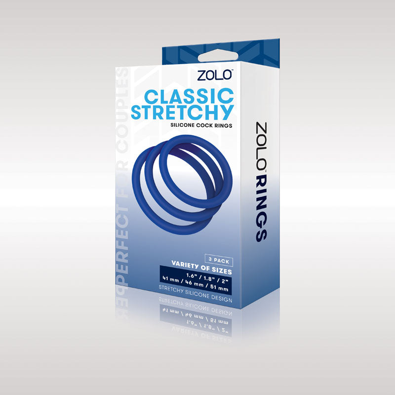 The image shows a Zolo Classic Stretchy Silicone Cock Ring 3-Pack. The primarily white and blue box displays three blue rings labeled Variety of Sizes in 41 mm, 36 mm, and 31 mm. Designed for partner play, it emphasizes enhanced stimulation with their stretchy silicone material.