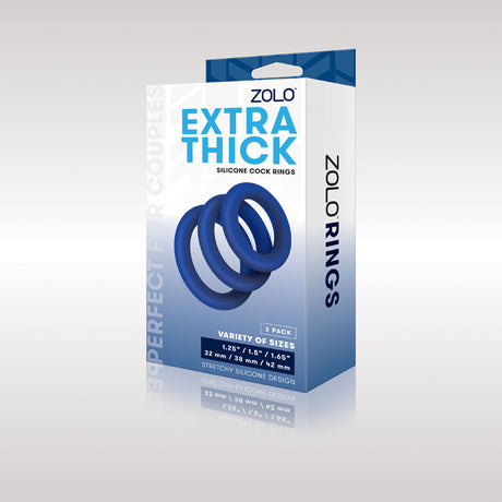 The image shows the Zolo Extra Thick Silicone Cock Rings 3-Pack in blue. The sleek packaging displays three silicone rings and highlights its a 3-pack. The box rests on a shiny surface.